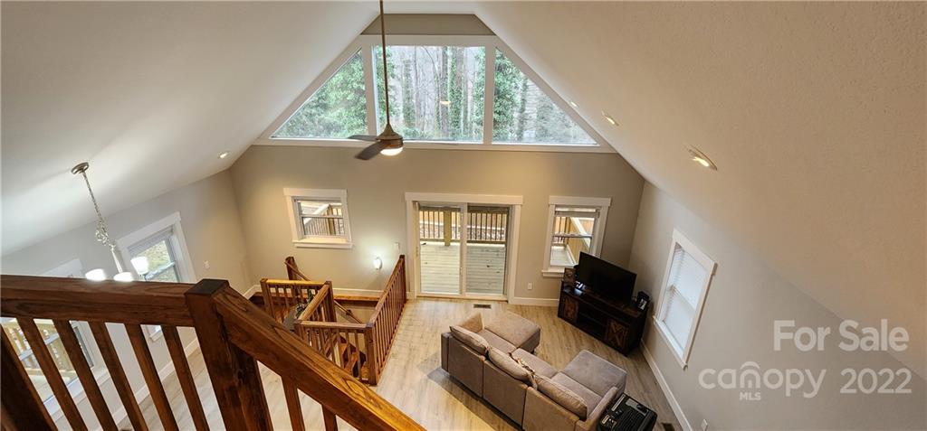 90 Ash Drive Maggie Valley, NC 28751 - Photo 15 of 27 a view of a living room with furniture and a floor to ceiling window
