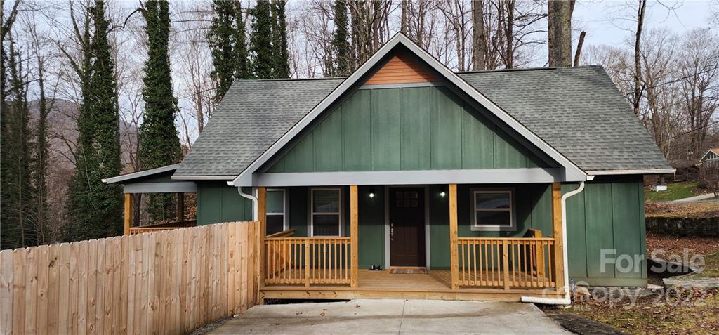 90 Ash Drive Maggie Valley, NC 28751 - Photo 18 of 27 a front view of a house with garden