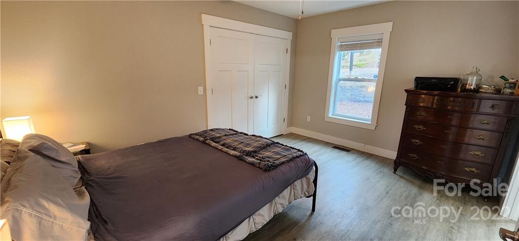 90 Ash Drive Maggie Valley, NC 28751 - Photo 23 of 27 a bedroom with a bed and a window
