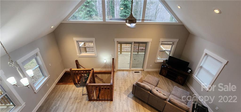 90 Ash Drive Maggie Valley, NC 28751 - Photo 3 of 27 a living room with furniture and a flat screen tv