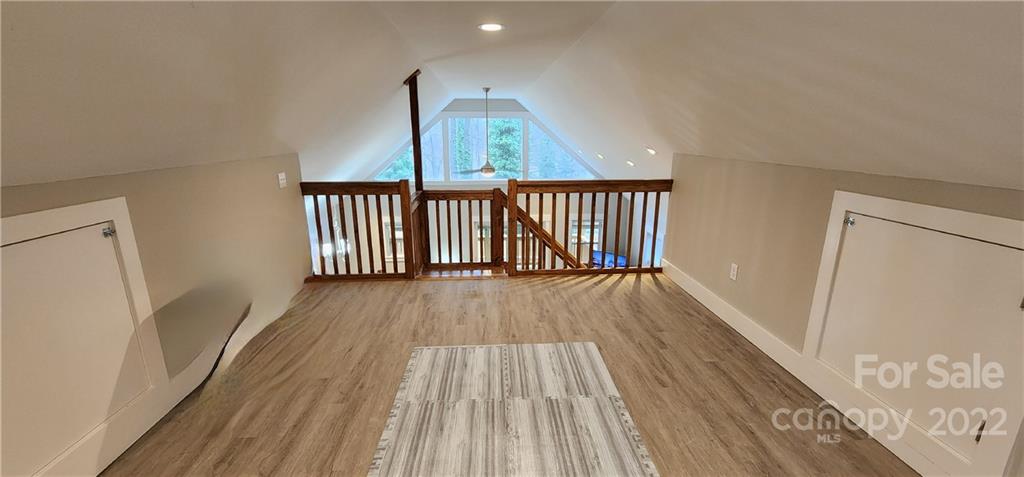90 Ash Drive Maggie Valley, NC 28751 - Photo 6 of 27 a view of a hallway view with wooden floor and staircase