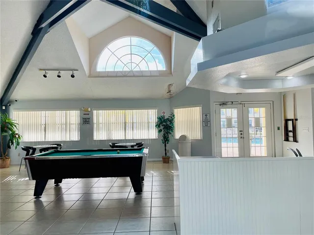 a kitchen with a table and chairs