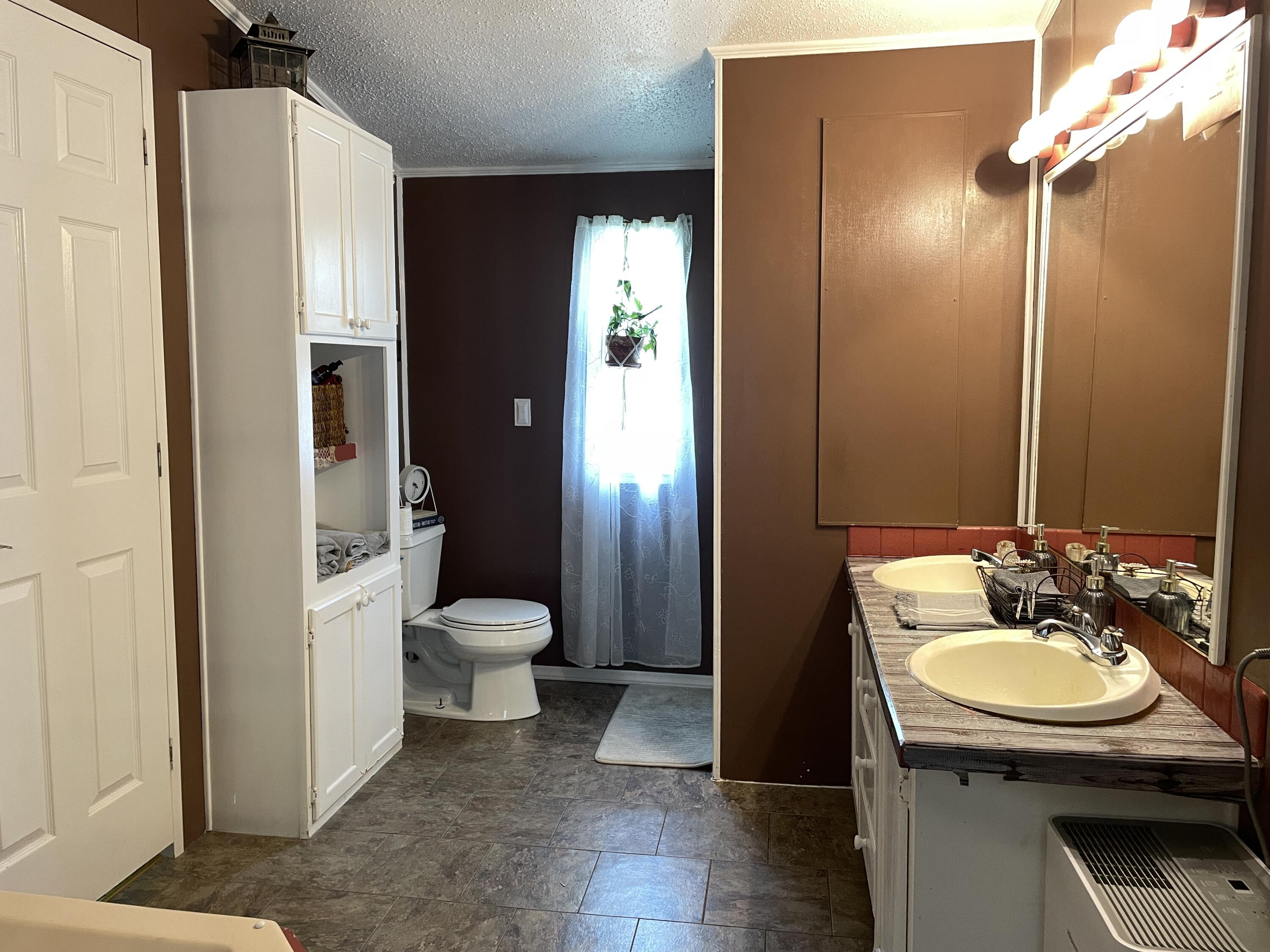 2166 Healing Springs Road Blackville, SC 29817 - Photo 17 of 43 a bathroom with a sink toilet and shower