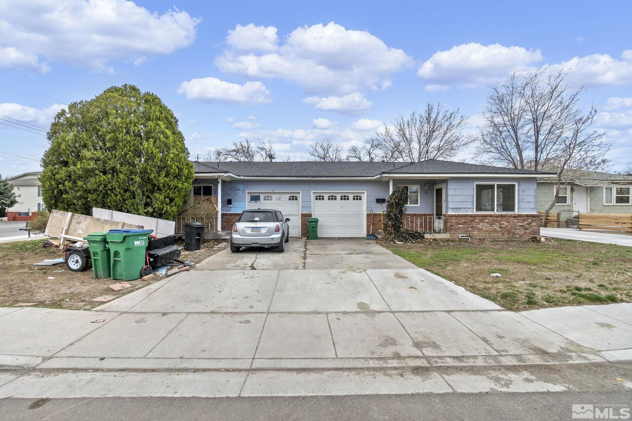 796-798 Moran Street Reno, NV 89502 - Photo 1 of 11 a front view of a house with garden