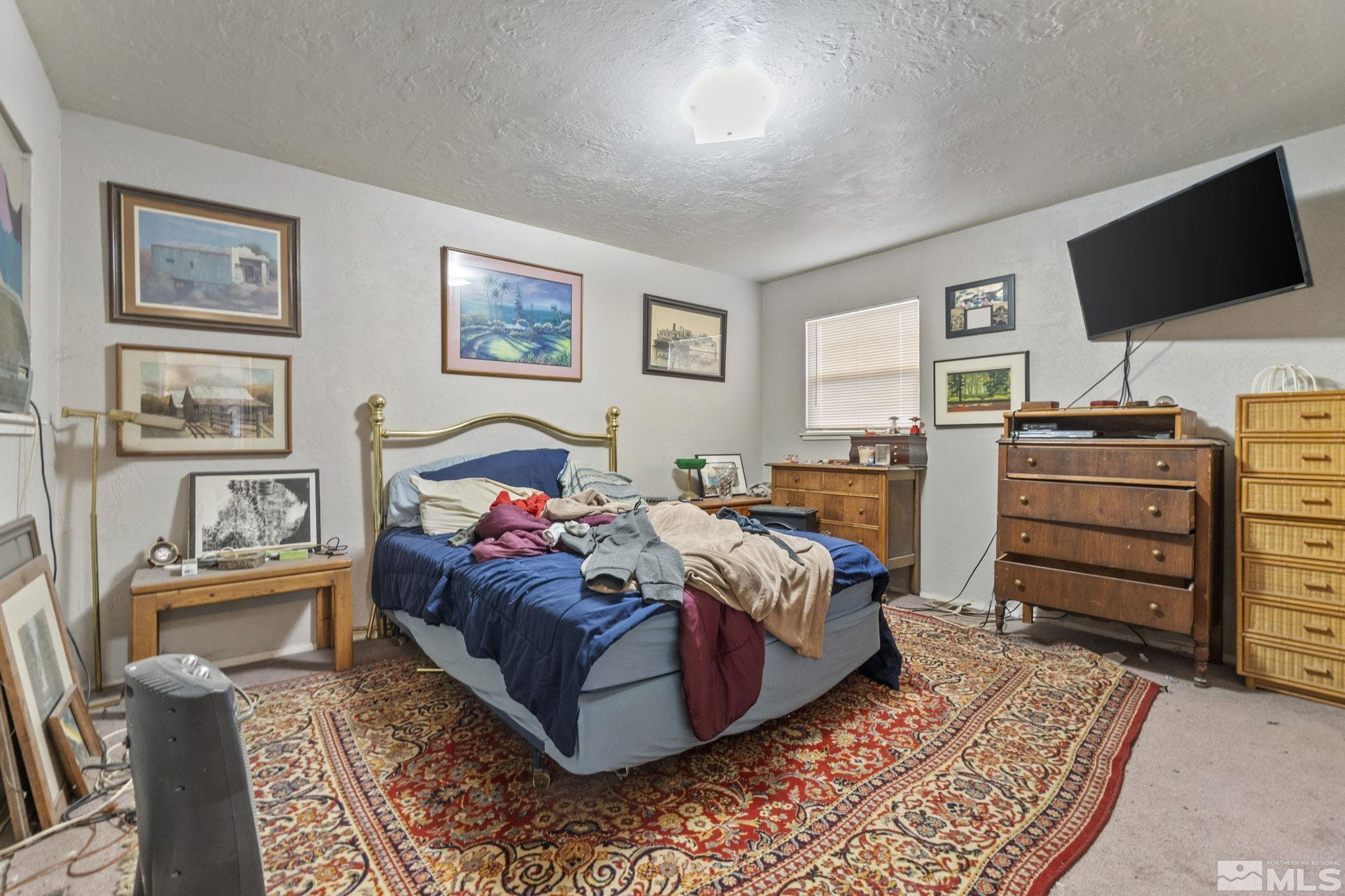 796-798 Moran Street Reno, NV 89502 - Photo 5 of 11 a bedroom with a bed and wooden floor