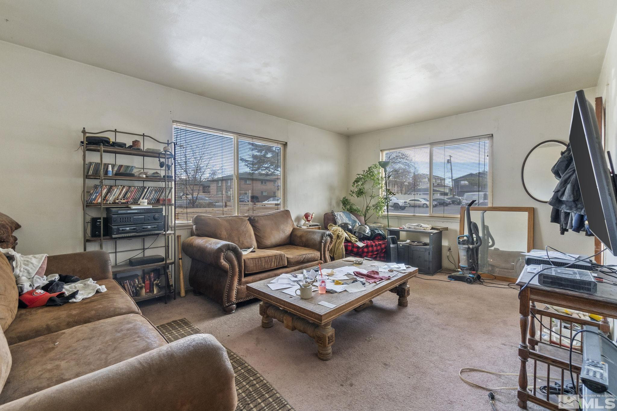796-798 Moran Street Reno, NV 89502 - Photo 7 of 11 a living room with furniture a rug kitchen view and a table