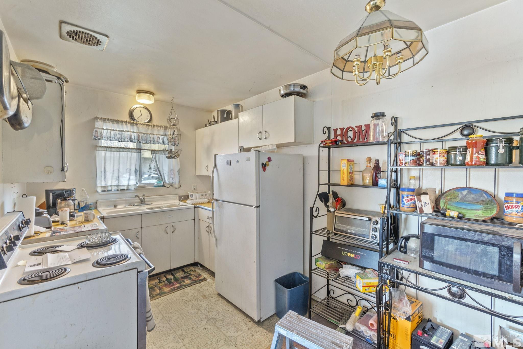 796-798 Moran Street Reno, NV 89502 - Photo 8 of 11 a kitchen with refrigerator and cabinets