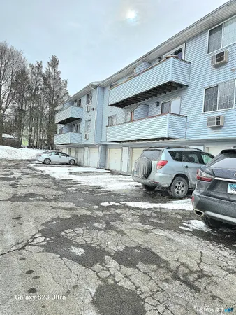 a view of a street with cars