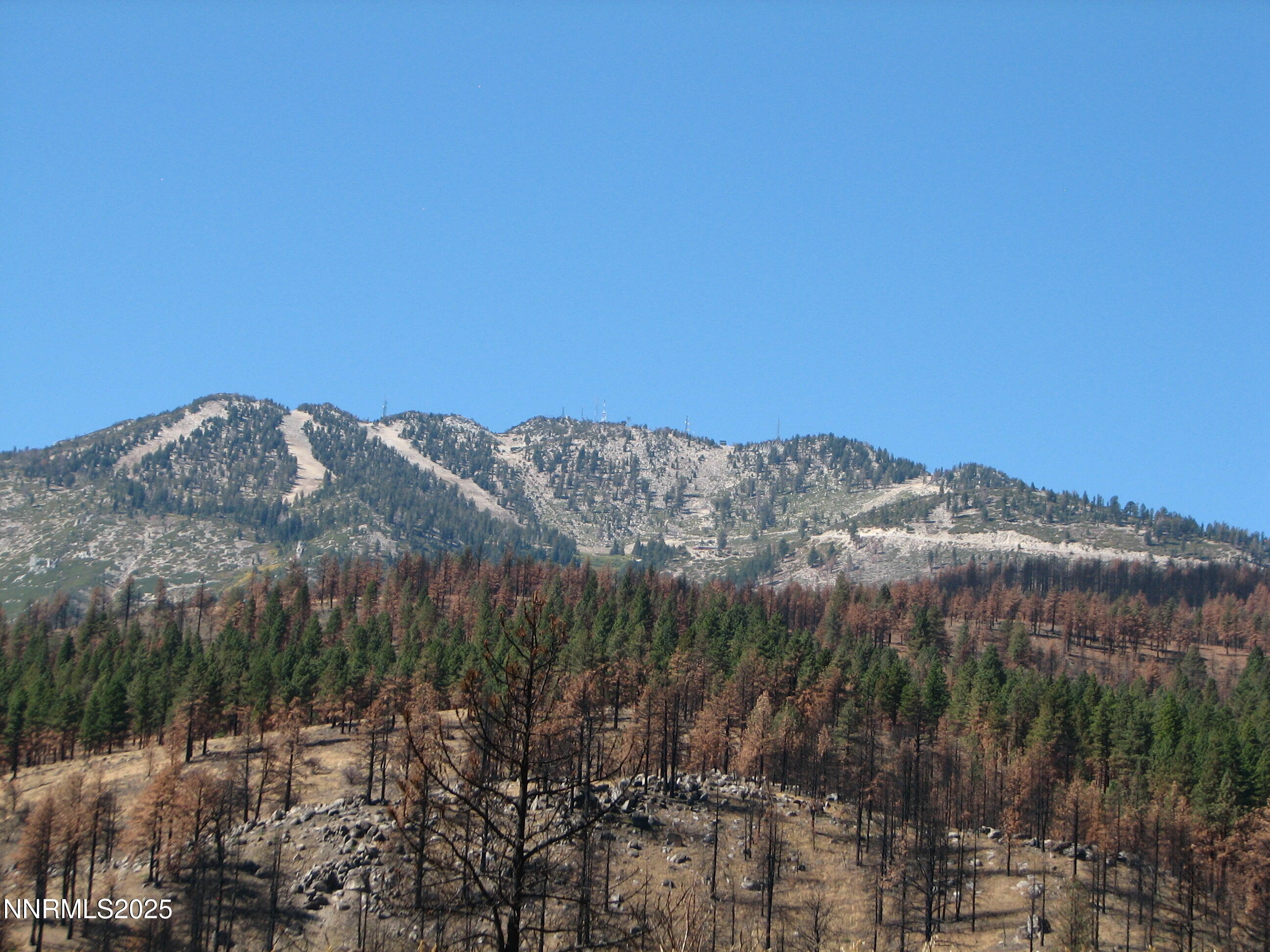 0 Joy Lake Road Washoe Valley, NV 89704 - Photo 14 of 15 a view of a large building with mountains in the background