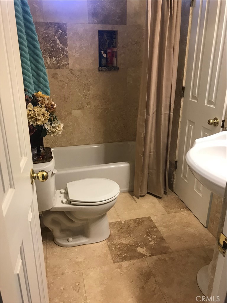 40820 Oak Ridge Drive Three Rivers, CA 93271 - Photo 18 of 65 a bathroom with a toilet and a shower