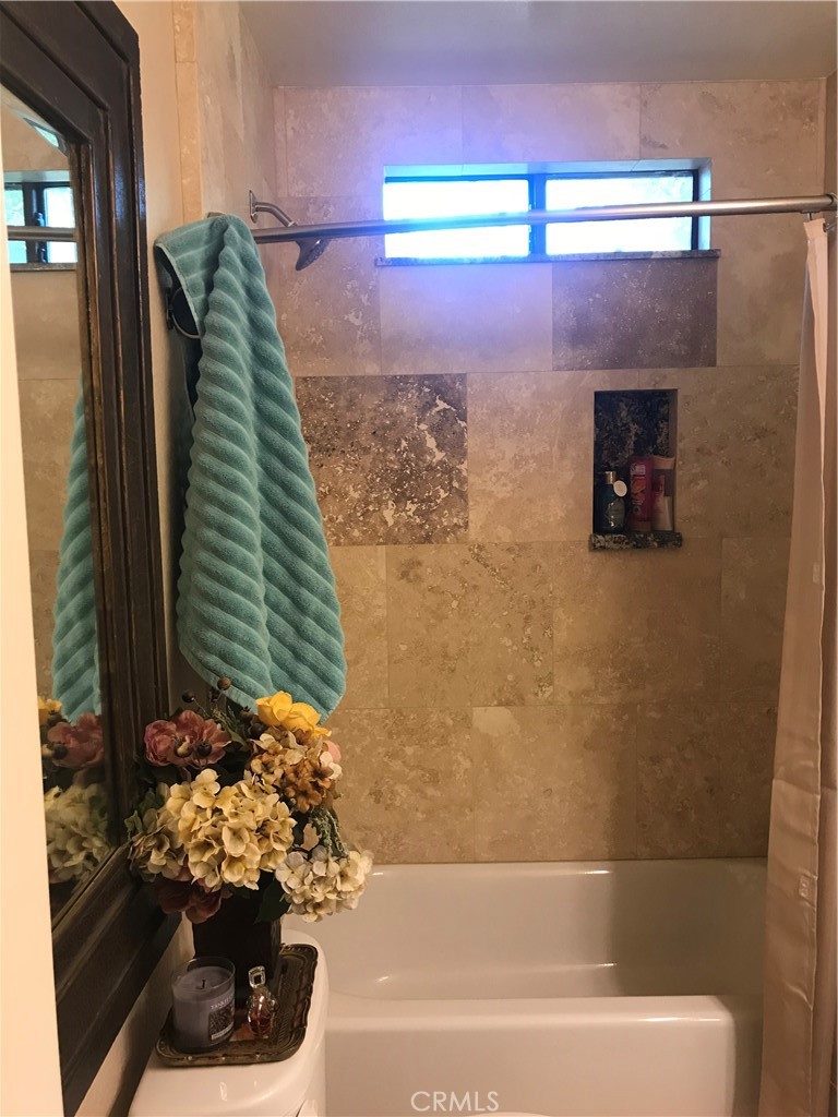 40820 Oak Ridge Drive Three Rivers, CA 93271 - Photo 19 of 65 a bathroom with a bathtub and a shower