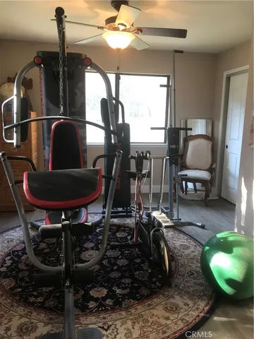 a bed room with a bed and a television