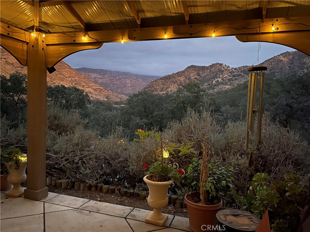 40820 Oak Ridge Drive Three Rivers, CA 93271 - Photo 39 of 65 a view of a balcony with chair and potted plants
