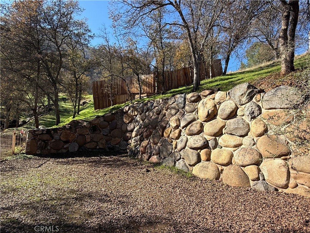 40820 Oak Ridge Drive Three Rivers, CA 93271 - Photo 47 of 65 a view of a yard with wooden fence