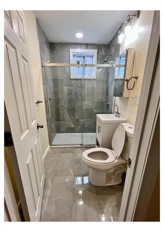 22 Anita Terrace, Unit 3 Boston, MA 02119 - Photo 5 of 11 a bathroom with a toilet and a shower
