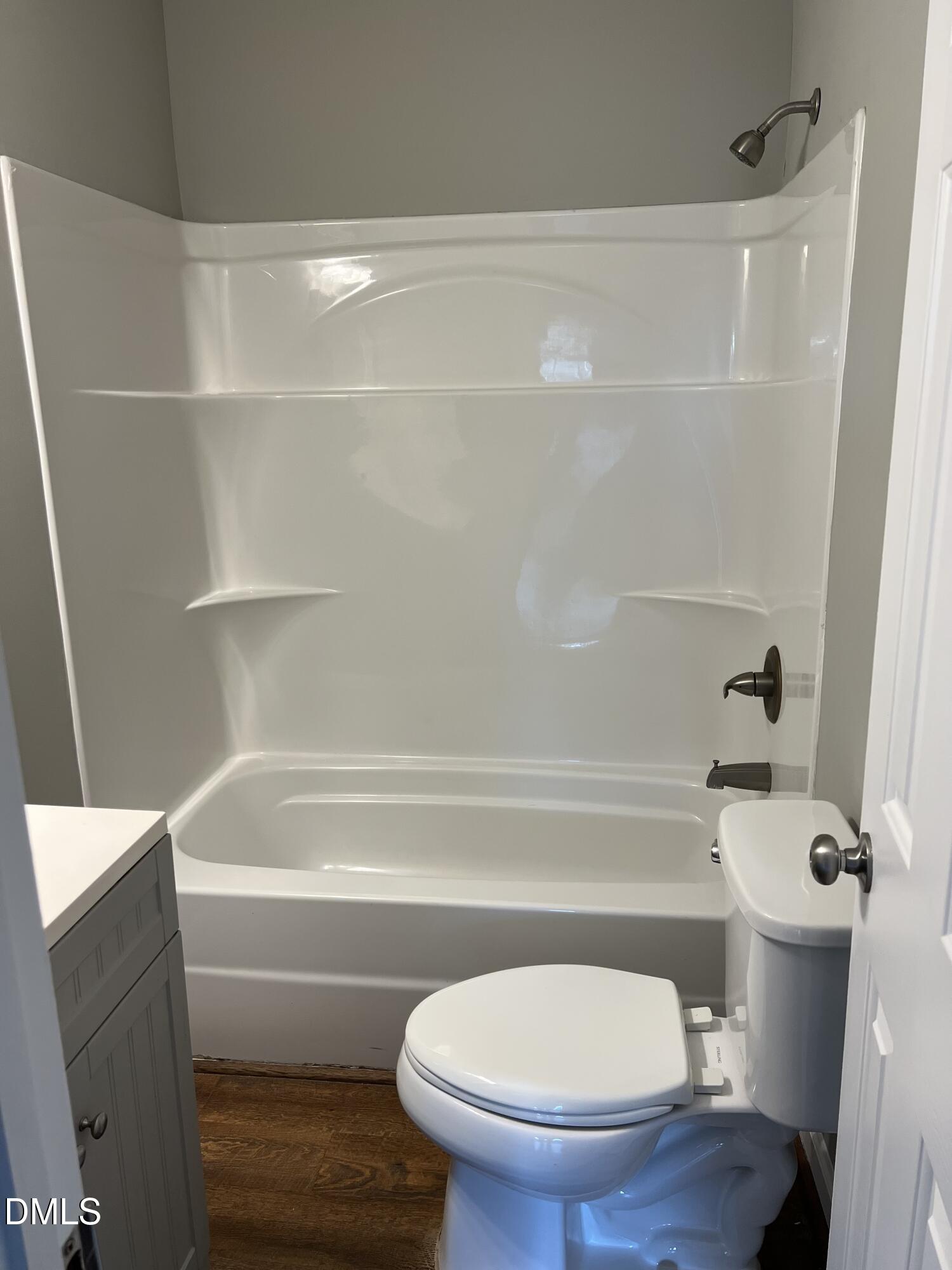 317 Brewer Road Louisburg, NC 27549 - Photo 11 of 14 a bathroom with a toilet and a bath tub