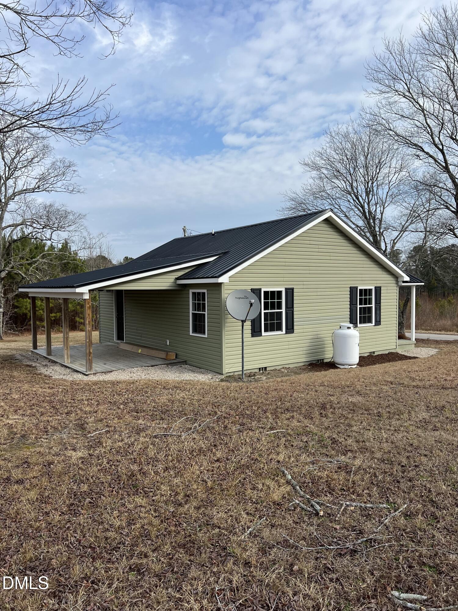 317 Brewer Road Louisburg, NC 27549 - Photo 2 of 14 a house view with a backyard space