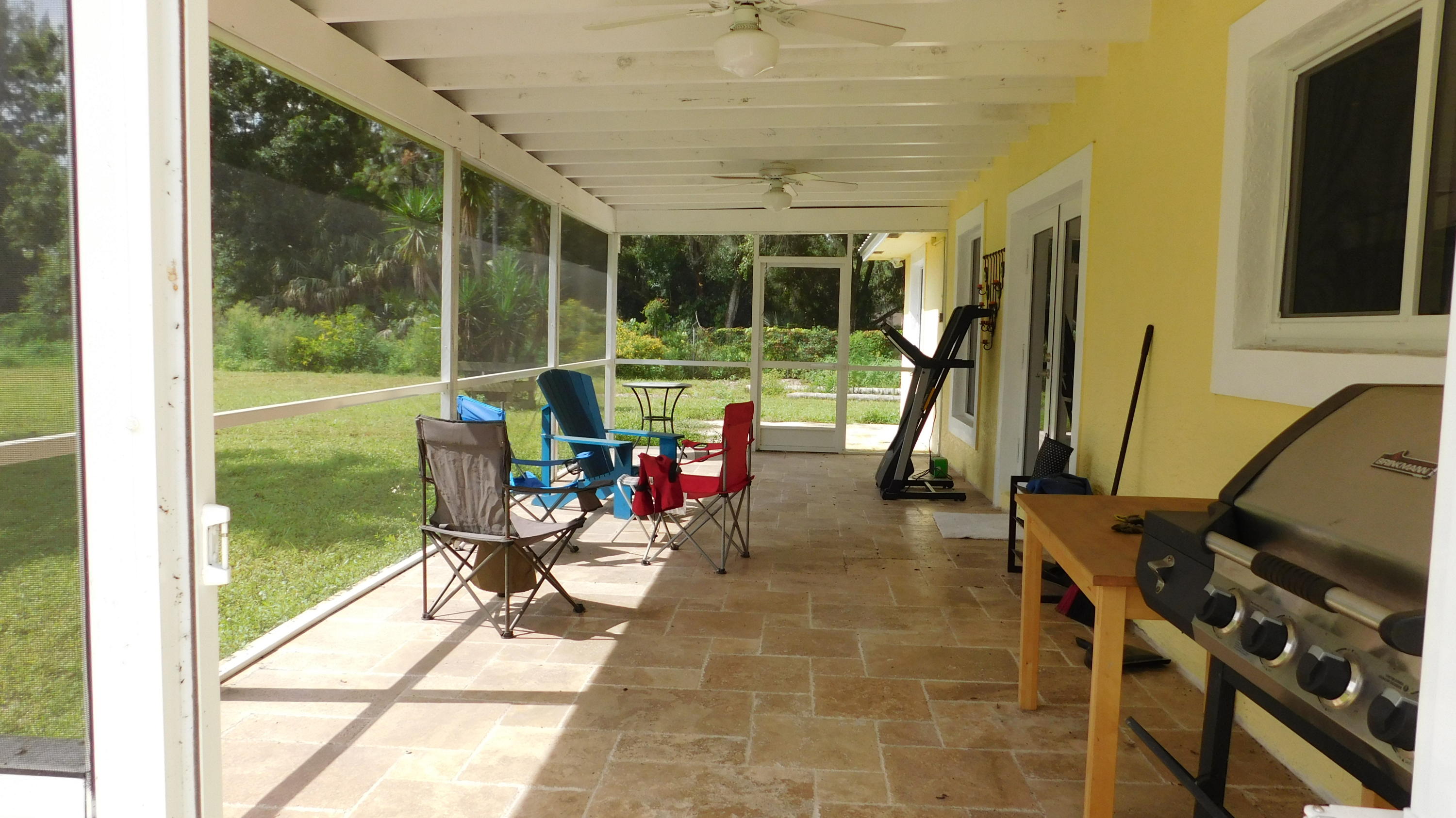 3330 C Road Loxahatchee Groves, FL 33470 - Photo 16 of 33 Screened back porch