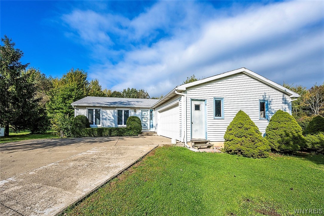 1172 Cain Road Evans, NY 14006 - Photo 1 of 1 Welcome to 1172 Cain Road. Concrete driveway in e