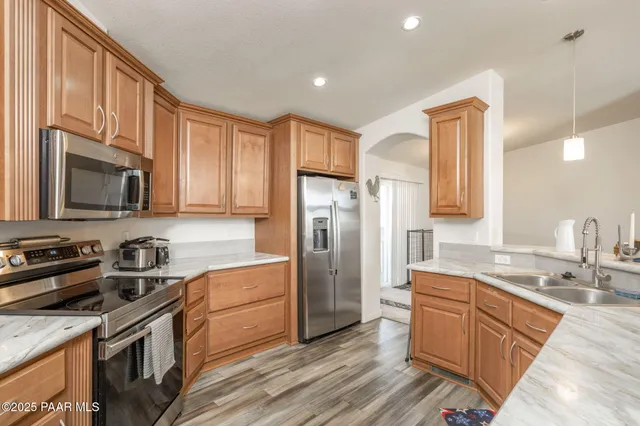 a kitchen with a sink stove and microwave
