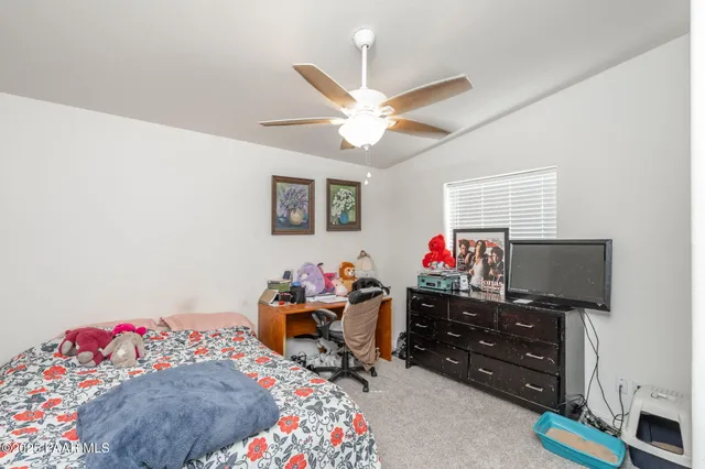 a bed room with a bed and a window