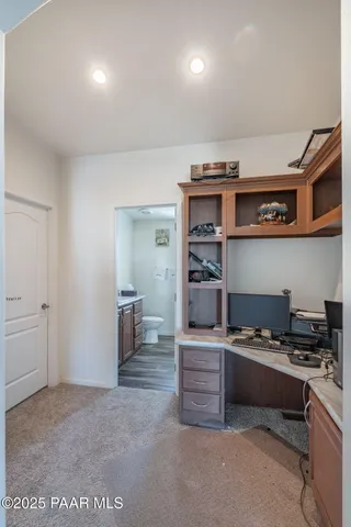 a view of kitchen with refrigerator and stove