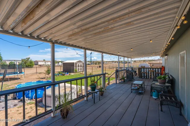 a view of a balcony with chairs