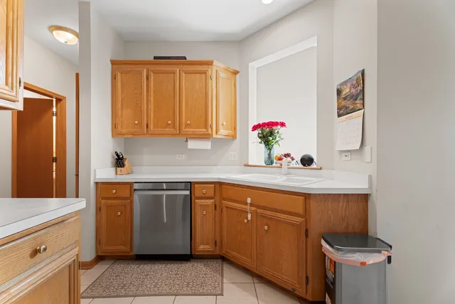 a kitchen with a sink cabinets and window