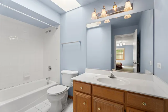 a bathroom with a sink a toilet and a bathtub