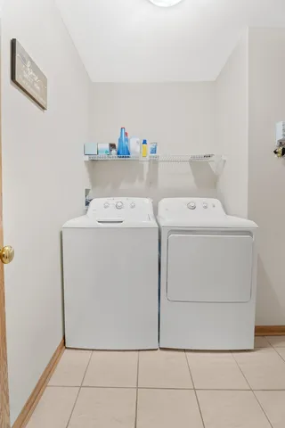 a large brick building with a yard in front of it