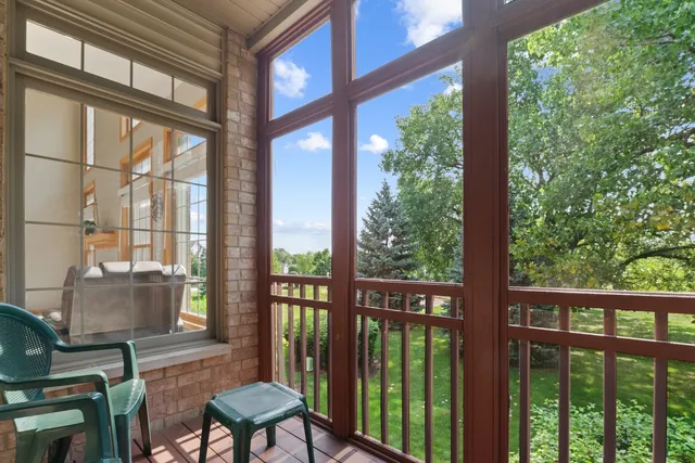 a view of a chair and table in the balcony