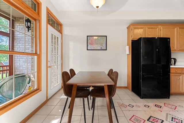 a view of a dining room with furniture and a window