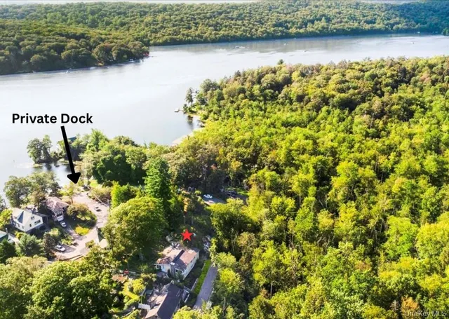 a view of a lake with a house in the background
