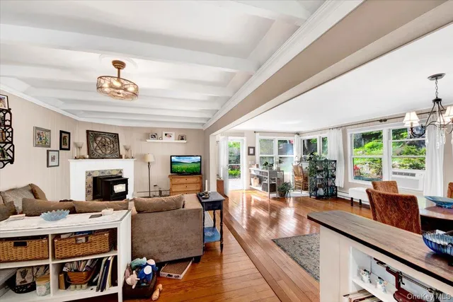 a living room with furniture fireplace and flat screen tv