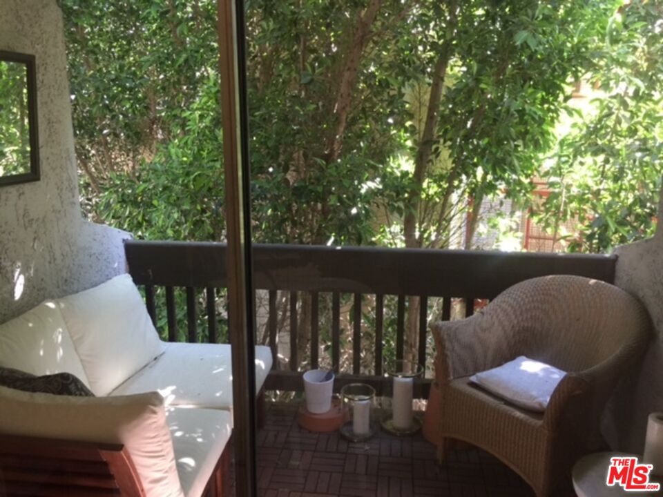 11730 Sunset Boulevard Los Angeles, CA 90049 - Photo 12 of 13 a view of balcony with couch and chairs