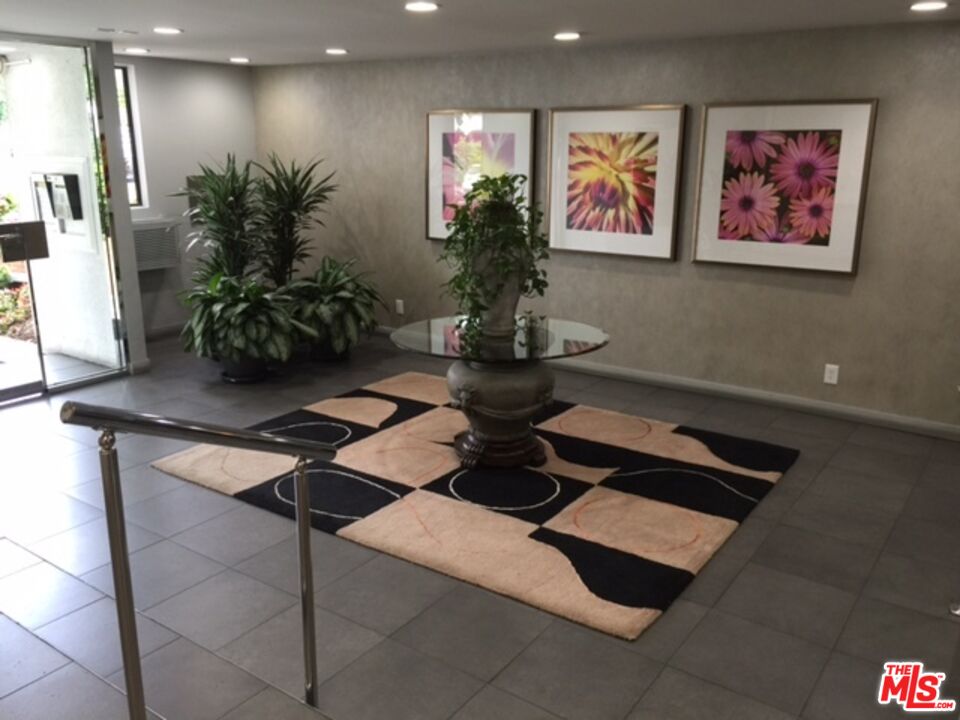 11730 Sunset Boulevard Los Angeles, CA 90049 - Photo 13 of 13 a room with furniture and potted plant