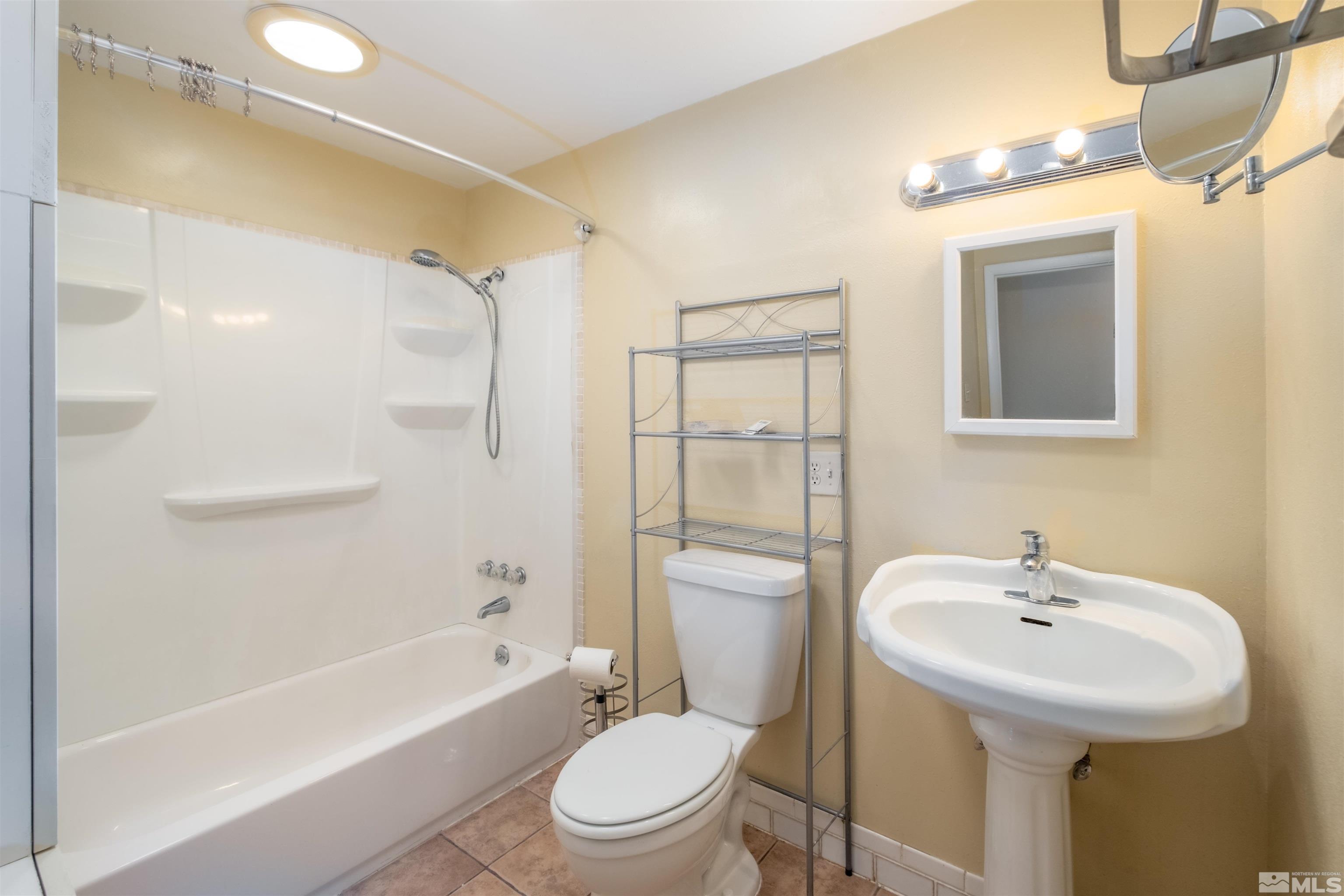 1800 West 6th Street Reno, NV 89503 - Photo 11 of 23 a bathroom with a sink a toilet and shower