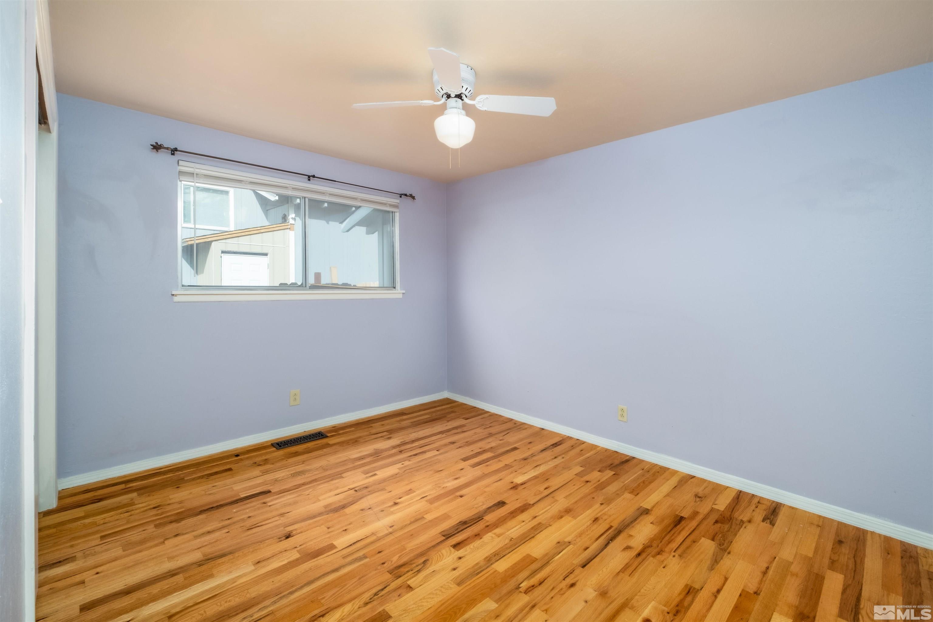 1800 West 6th Street Reno, NV 89503 - Photo 12 of 23 an empty room with wooden floor and windows