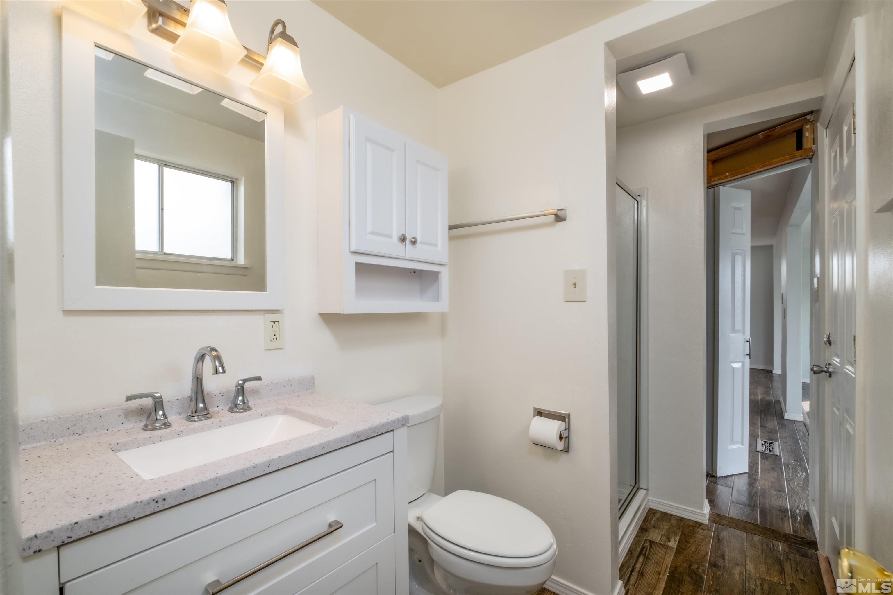1800 West 6th Street Reno, NV 89503 - Photo 15 of 23 a bathroom with a sink a toilet and shower