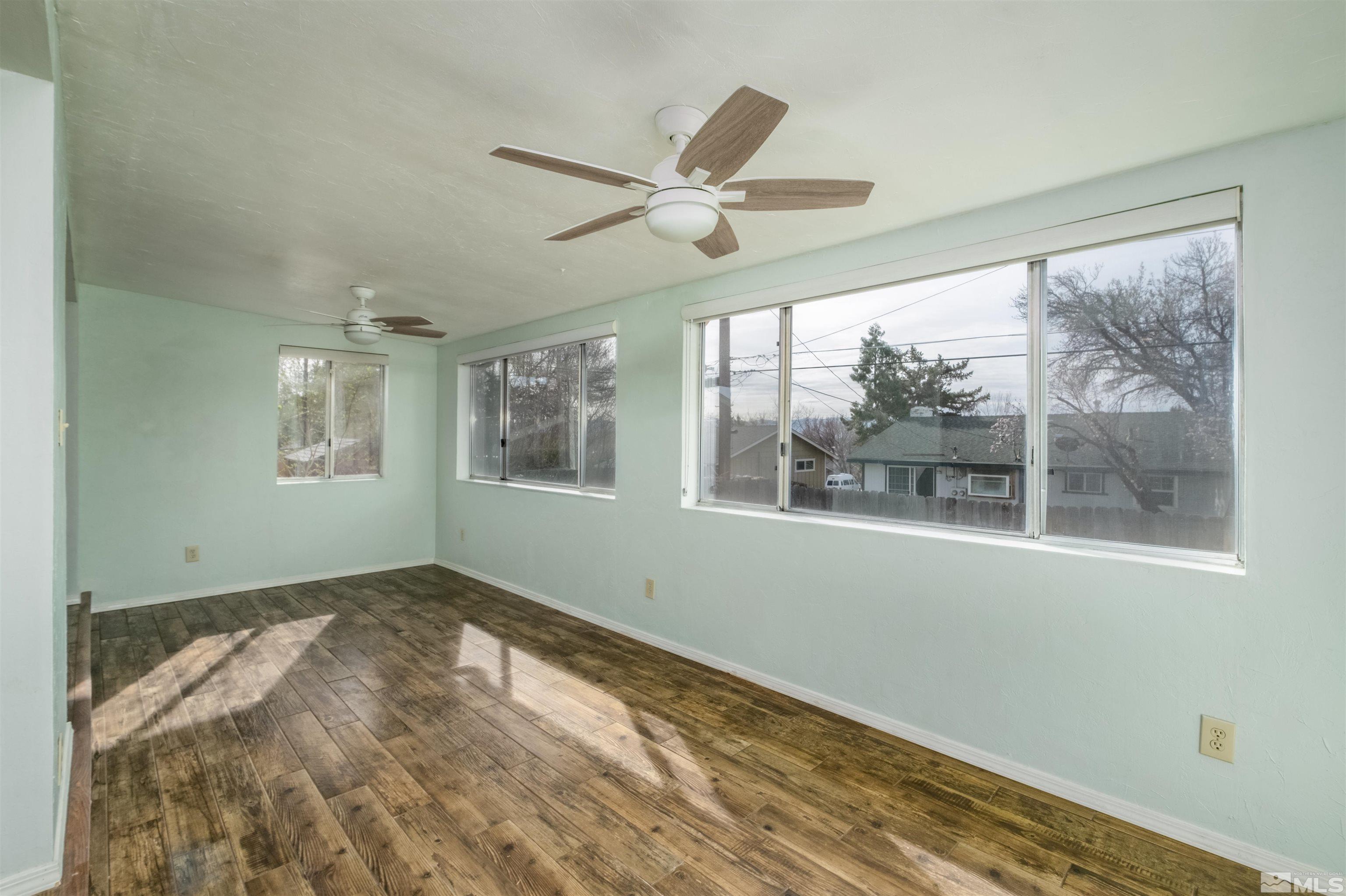 1800 West 6th Street Reno, NV 89503 - Photo 17 of 23 a view of empty room with wooden floor and fan
