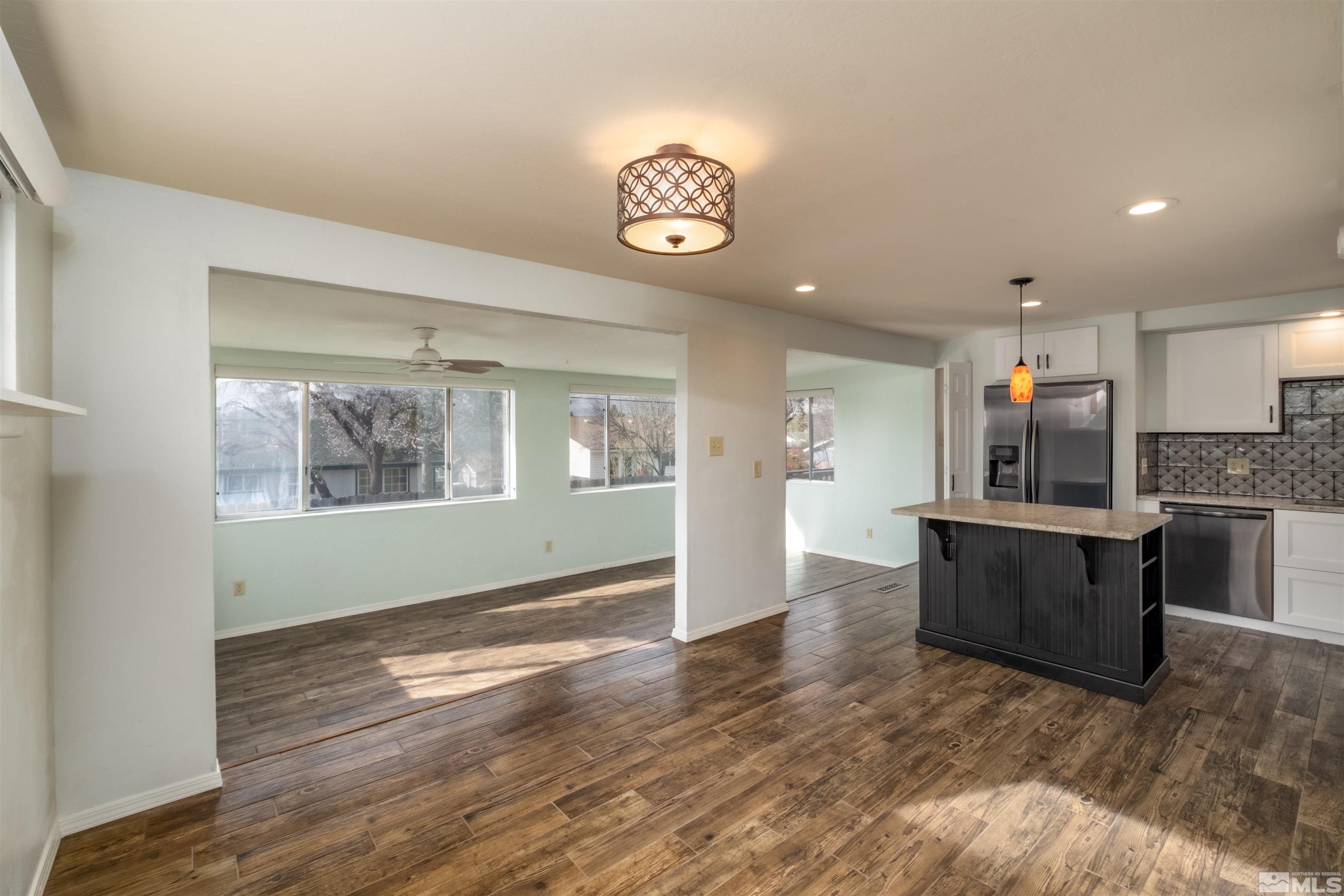 1800 West 6th Street Reno, NV 89503 - Photo 19 of 23 a view of an empty room with window and wooden floor