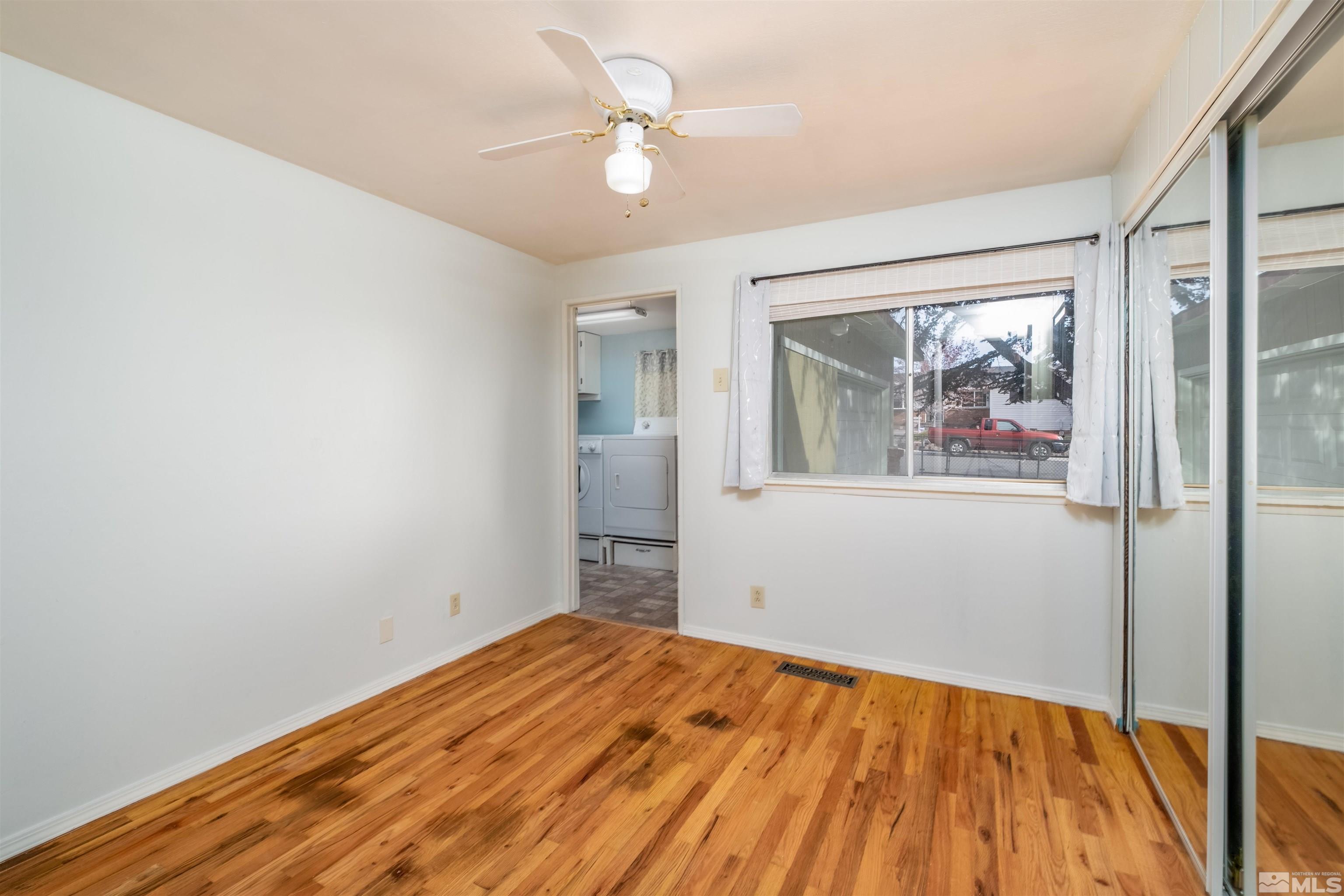 1800 West 6th Street Reno, NV 89503 - Photo 21 of 23 a view of empty room with wooden floor and fan