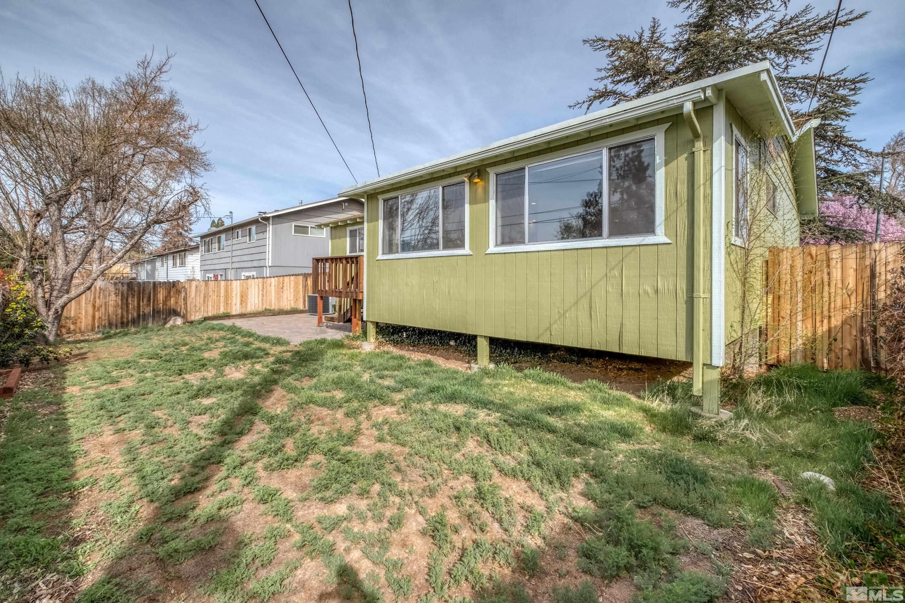 1800 West 6th Street Reno, NV 89503 - Photo 4 of 23 a front view of a house with a yard