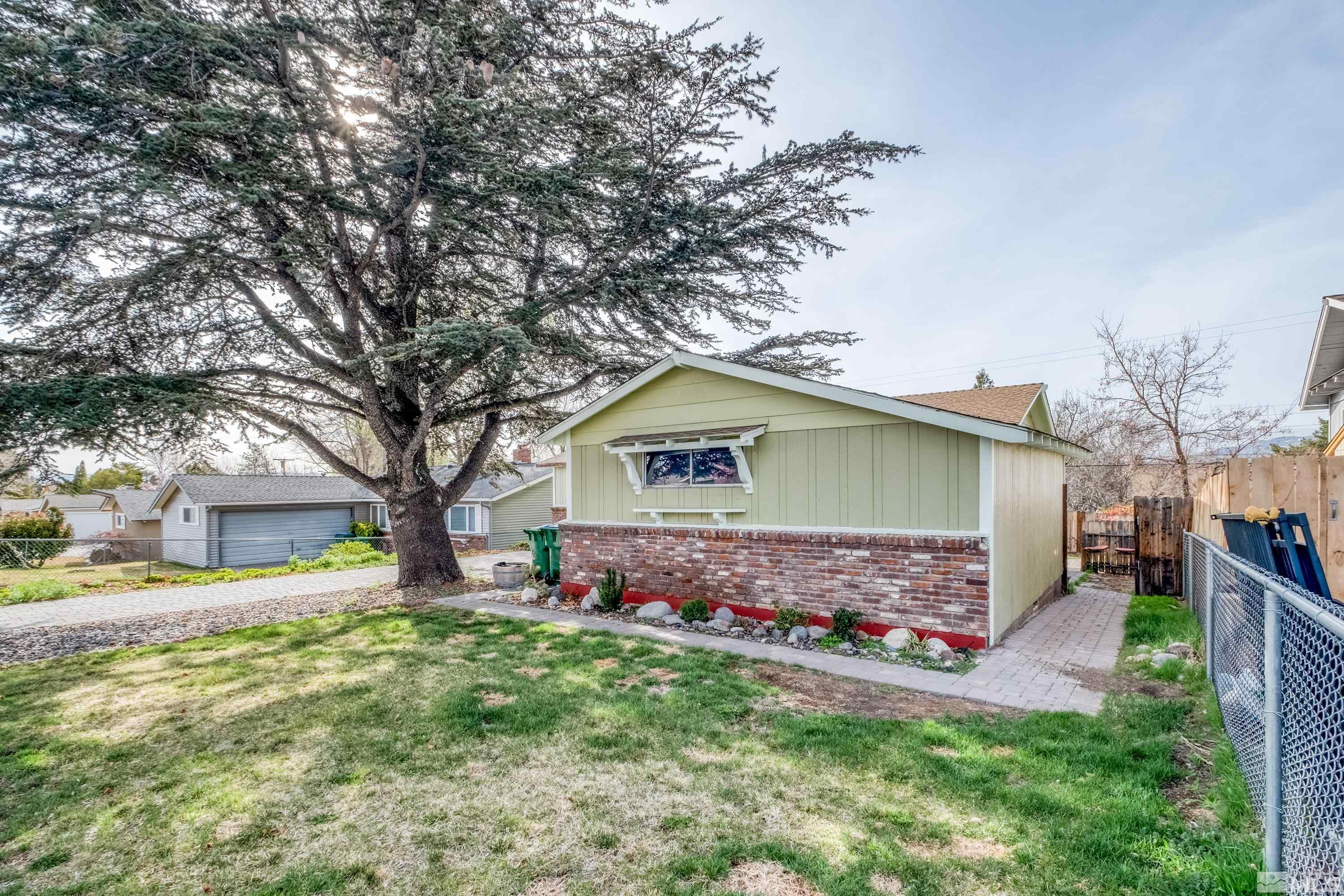 1800 West 6th Street Reno, NV 89503 - Photo 8 of 23 a front view of house with yard and trees around