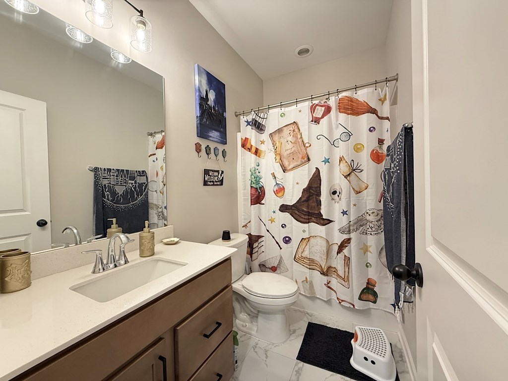 33 Sugar Maple Drive Fort Mitchell, AL 36856 - Photo 15 of 29 a bathroom with a sink and a mirror