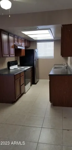 a kitchen with stainless steel appliances granite countertop a sink and cabinets
