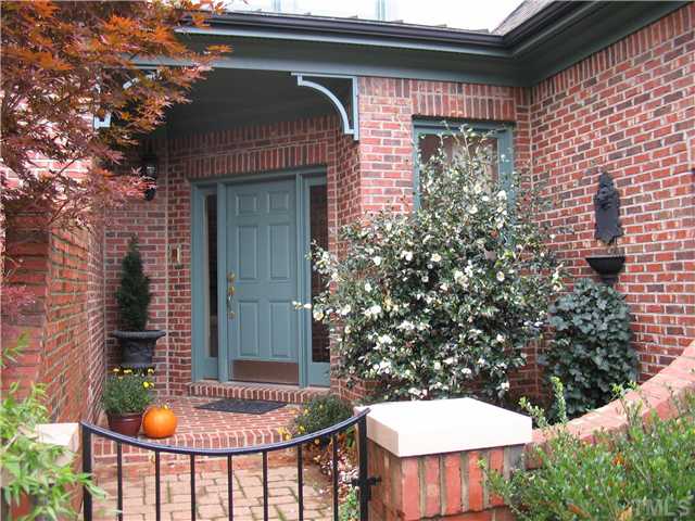 Gated courtyard leads to the entry of this exceptional townhome.