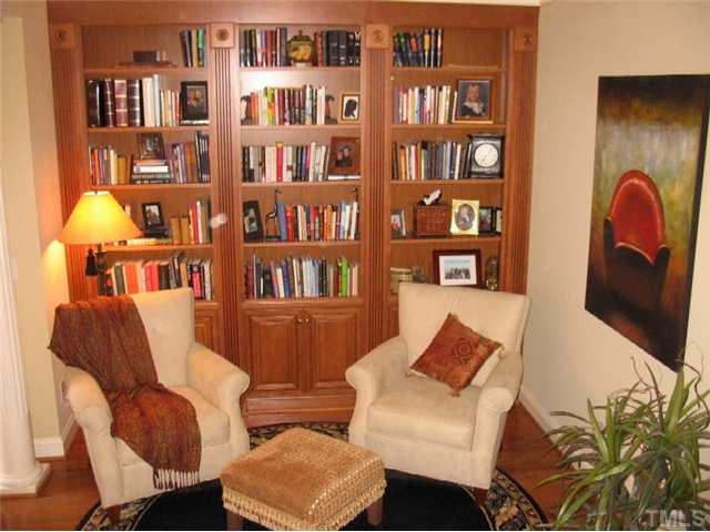 Floor to ceiling bookcases in the living room are one of the special features in this home.
