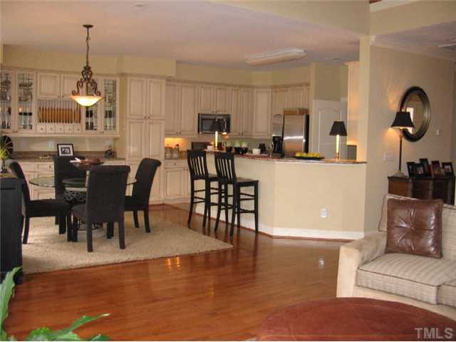 8214 Lloyd Allyns Way Raleigh, NC 27615 - Photo 16 of 16 Open floor plan perfect when entertaining. An extensive array of designer cabinetry highlights the kitchen.