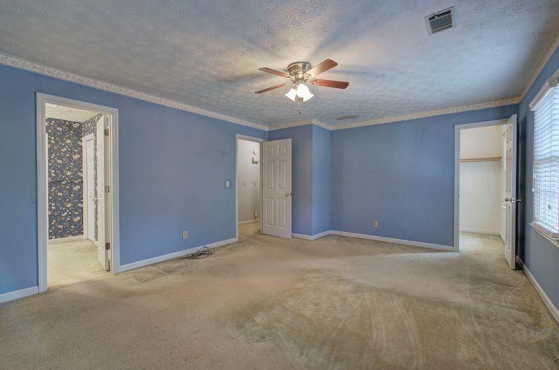 260 Spring Ridge Drive Roswell, GA 30076 - Photo 21 of 52 a view of an empty room with a ceiling fan